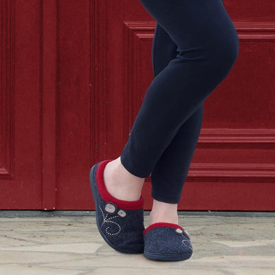 Women's Dara Boiled Wool Slippers in Charcoal Button on Model in Front of a Red Door