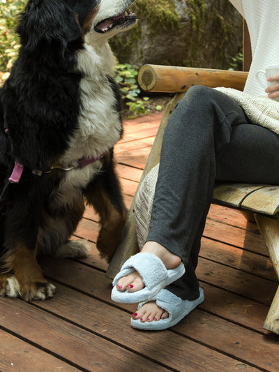 Women's Spa Slide Slippers in powder blue  with dog sitting on a deck