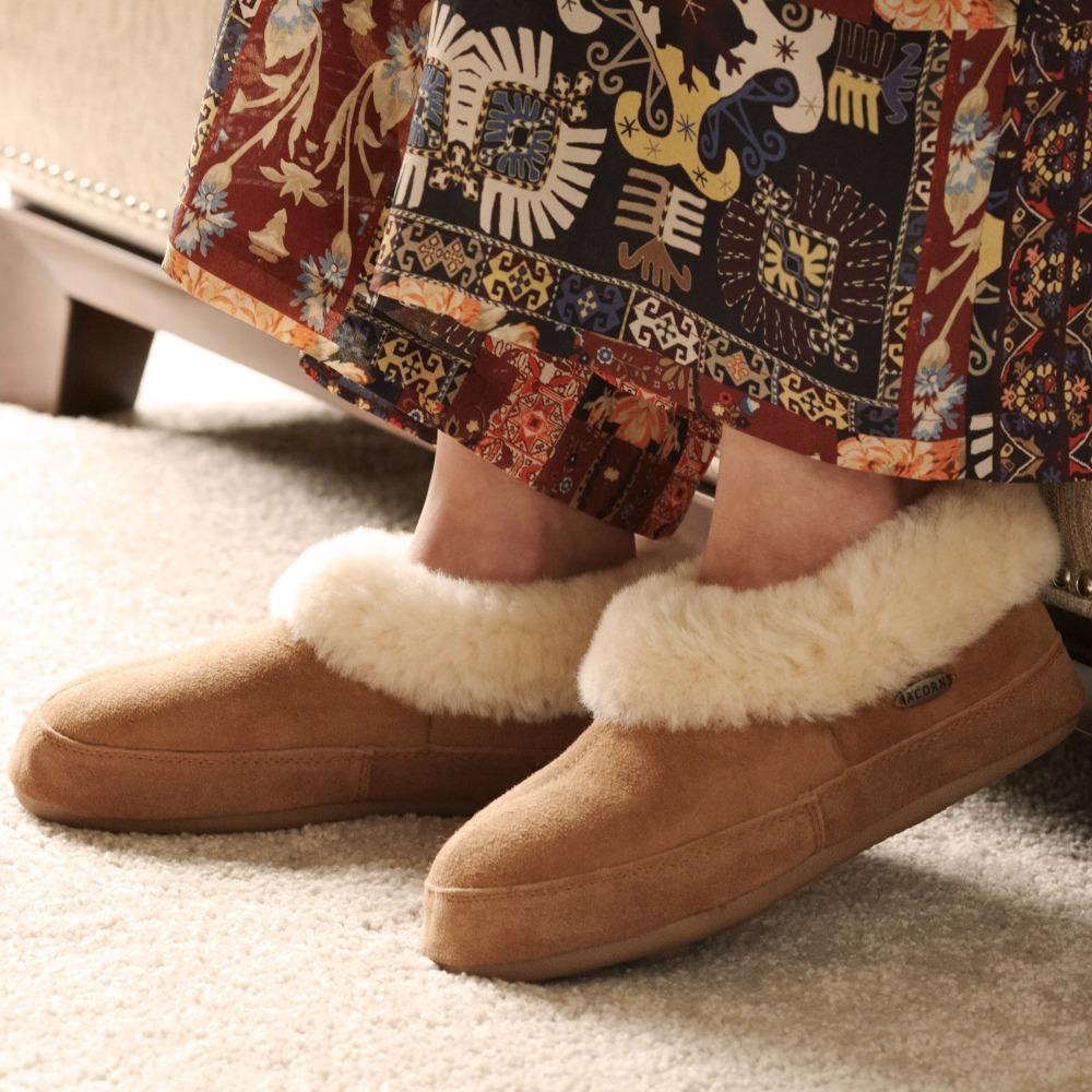 Women's Oh Ewe Boot Slippers on figure wearing boho skirt sitting on chair indoors