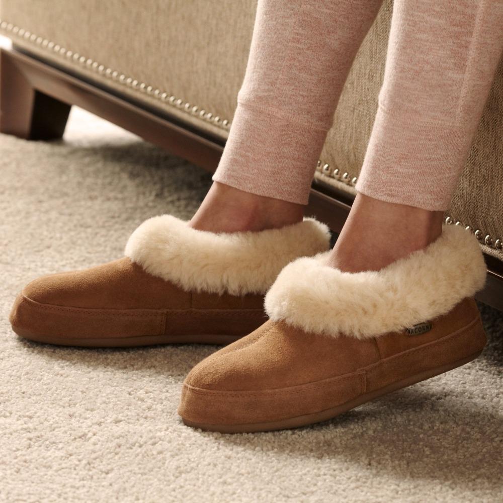 Women's Shearling Collar Slippers on figure sitting on couch inside with leggings on