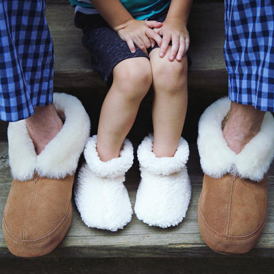 Toddler's Fuzzy Booties in Buff Popcorn on Model with Father in Ewe Collar Slippers
