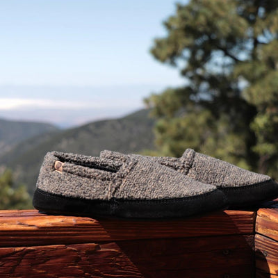 Men's Original Acorn Moccasins in Earth Tex On Wood  in Front of Mountain